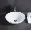 A white oval washbasin with a chrome faucet is shown on a dark gray countertop. Produktbild-Vorschau