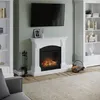 A living room scene featuring a white electric fireplace with a fire burning, flanked by bookshelves, with a television mounted above the fireplace. Produktbild-Vorschau
