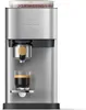 A silver espresso machine with a glass of espresso in front of it. Voir les images du produit