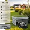 A garden scene with a robotic lawnmower garage and two small garden sheds in the background. Náhled obrázku produktu