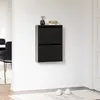 A black shoe cabinet mounted on a white wall. Produktbild-Vorschau