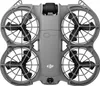 A top-down view of a gray drone with black propellers and protective cages. Produktbild-Vorschau