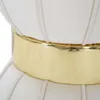 A close-up view of a cream-colored, pleated stool or ottoman with a wide, shiny gold band around its middle. Produktbild-Vorschau