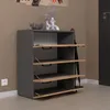 A modern shoe cabinet with four flip-down drawers, an umbrella holder, and decorative vases on top, placed in a hallway. Produktbild-Vorschau