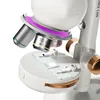 Close-up of a microscope's objective lens turret and stage with a slide. Produktbild-Vorschau