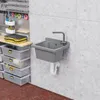 A workshop or utility room setting with a sink mounted on a concrete wall, surrounded by storage bins and tools. Náhled obrázku produktu