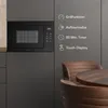 A built-in microwave oven is shown in a modern kitchen setting, with feature callouts on the right side. Produktbild-Vorschau
