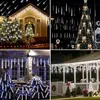 Collage of four images showing Christmas lights on houses and trees. Produktbild-Vorschau