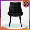 A black velvet dining chair with quilted detailing and black metal legs is displayed on a white pedestal against a white background with purple and orange gradient accents. Anteprima dell’immagine prodotto