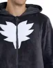 Close-up of a person wearing a dark gray onesie with a white leaf-like emblem on the chest. Produktbild-Vorschau