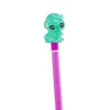 A close-up of a pencil with a green toy animal on top. Podgląd zdjęcia produktu