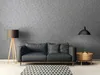 A living room scene with a sofa, floor lamp, and side table. Produktbild-Vorschau