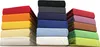 Stacks of folded fabric sheets in various colors. Produktbild-Vorschau