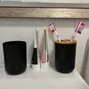 A bathroom sink with toiletries. Voir les images du produit