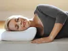 A woman is sleeping on her side on a pillow. Produktbild-Vorschau