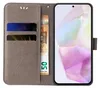 A flip cover phone case with card slots and a banknote, alongside a smartphone displaying a colorful abstract image. Produktbild-Vorschau