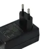 A close-up, angled shot of a black power adapter with European-style prongs, set against a white background. Produktbild-Vorschau