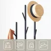 A coat rack with a hat and a scarf on it, with icons representing clothing items below. Náhled obrázku produktu