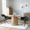 A dining set with two green chairs and a wooden table in a room. Produktbild-Vorschau