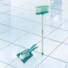 A broom and dustpan set on a tiled floor. Podgląd zdjęcia produktu