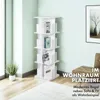 A white rotating bookshelf is placed in a room next to a sofa and a framed picture on the wall. Podgląd zdjęcia produktu