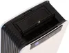 Close-up view of the top section of a white and black dehumidifier. Produktbild-Vorschau