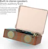 A retro-style music player with built-in speakers and a transparent lid, shown from a slightly elevated angle. Produktbild-Vorschau