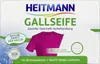 Product packaging for Heitmann Gallseife, showing a pink t-shirt and white fabric, with text highlighting its cleaning properties. Produktbild-Vorschau