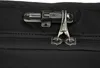 A close-up view of a black bag's zipper and lock. Anteprima dell’immagine prodotto