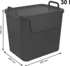 A dark gray plastic trash bin with a lid and handles, shown from a slightly elevated front-left angle. Dimensions are indicated with measurement lines and text. Produktbild-Vorschau