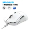 A white wireless gaming mouse is shown from a slightly elevated front-left angle, with a USB-C cable plugged into its front. Produktbild-Vorschau