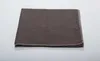 A folded brown blanket is shown on a light gray surface. Produktbild-Vorschau