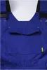 A close-up view of the chest area of blue overalls, showing a pocket and straps. Produktbild-Vorschau