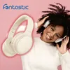 A woman is happily wearing headphones, with a pair of headphones floating in the foreground. Produktbild-Vorschau