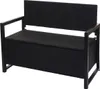 A black poly-rattan bench with a storage compartment, shown from a front-side angle against a white background. Voir les images du produit