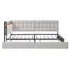 A beige upholstered daybed with a metal frame and wooden accents, shown from the front with the mattress platform visible. Podgląd zdjęcia produktu