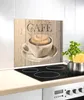 A kitchen backsplash with a graphic of a coffee cup and the word 'Café' on a wooden background, placed behind a stovetop. Produktbild-Vorschau
