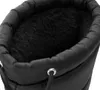 Close-up view of the inside of a black snow boot. Voir les images du produit