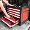 A person is shown interacting with a Yato tool chest with multiple drawers. Produktbild-Vorschau