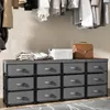 A storage unit with fabric drawers and a wooden top, with clothes and a briefcase on top. Podgląd zdjęcia produktu