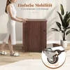 A woman is pushing a wooden cabinet with wheels, and a close-up of a wheel with a lock is shown. Anteprima dell’immagine prodotto