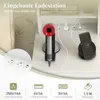 A close-up view of a built-in charging station with a hairdryer and a smartphone on a wireless charger. Voir les images du produit