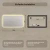 Diagrams showing the dimensions and mounting of a backlit mirror. Produktbild-Vorschau