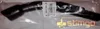 A black vacuum cleaner handle is shown inside its plastic packaging. Produktbild-Vorschau