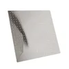 A square shower head with many small holes, angled to show its surface. Anteprima dell’immagine prodotto