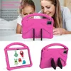 A mother and daughter are looking at a pink tablet case. Náhled obrázku produktu