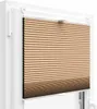 A close-up view of a pleated blind installed in a window frame. Produktbild-Vorschau