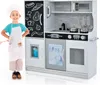 A child dressed as a chef stands next to a toy kitchen. Produktbild-Vorschau