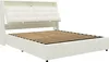 A white upholstered bed frame with a slatted mattress support. Produktbild-Vorschau