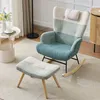 A cozy living room setting with a rocking chair and ottoman. Produktbild-Vorschau